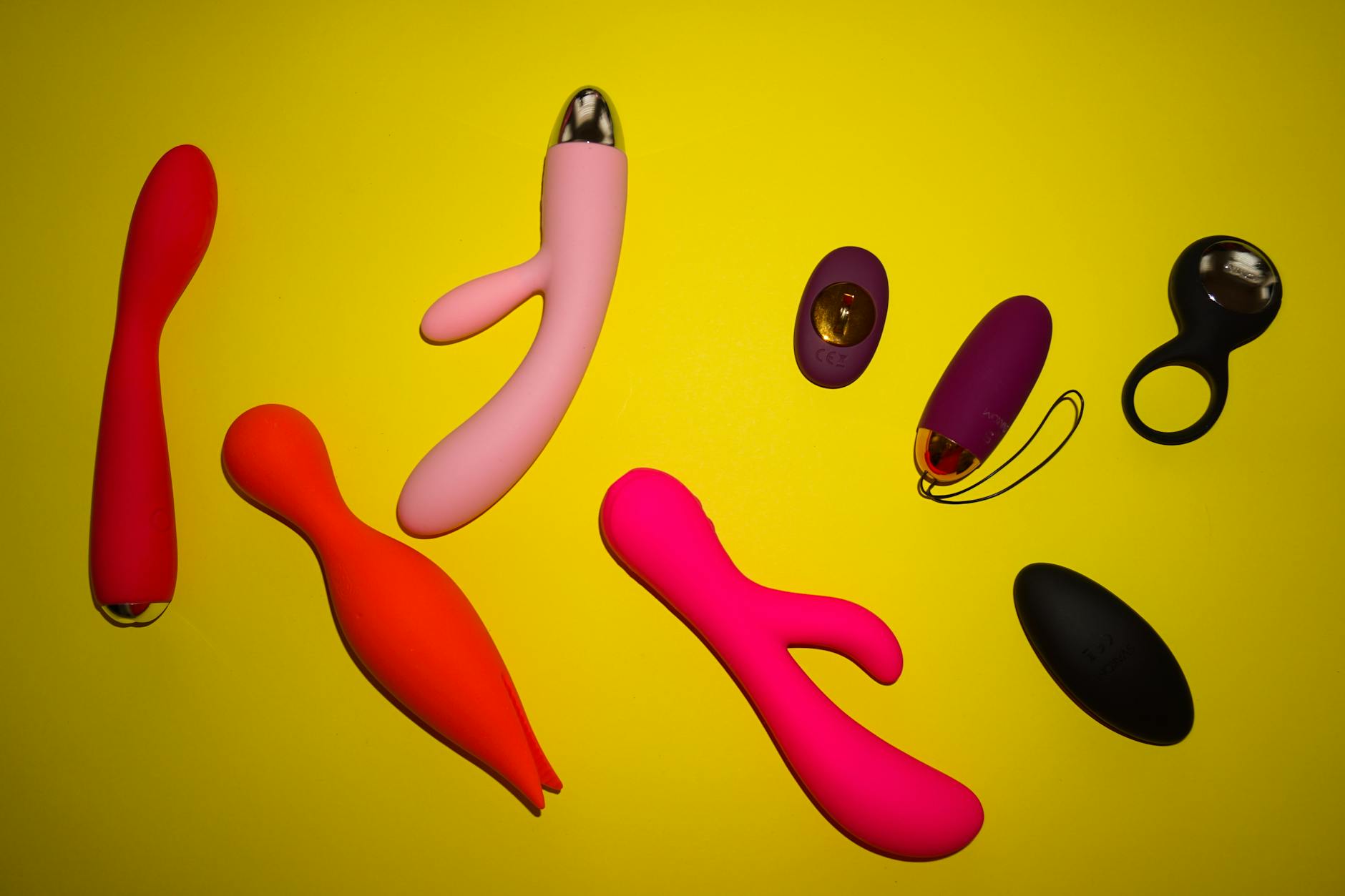 Colorful lemon vibrators and sex toys arranged on a bright surface, showcasing Lemnancy Shop product variety